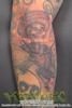 Bandido skull sombrero arms crossed pistols smoking